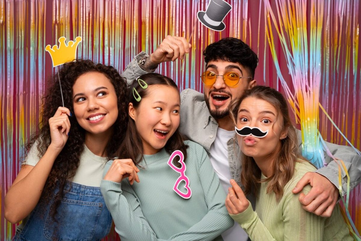 medium-shot-friends-posing-photo-booth_23-2150191513